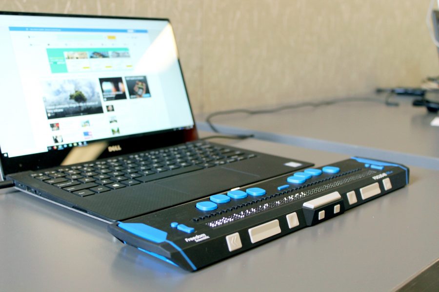 Laptop with a refreshable braille display bar