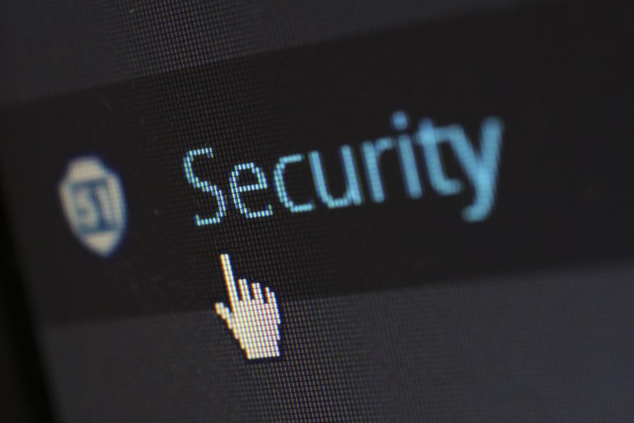 Hand cursor hovering over the word Security on screen