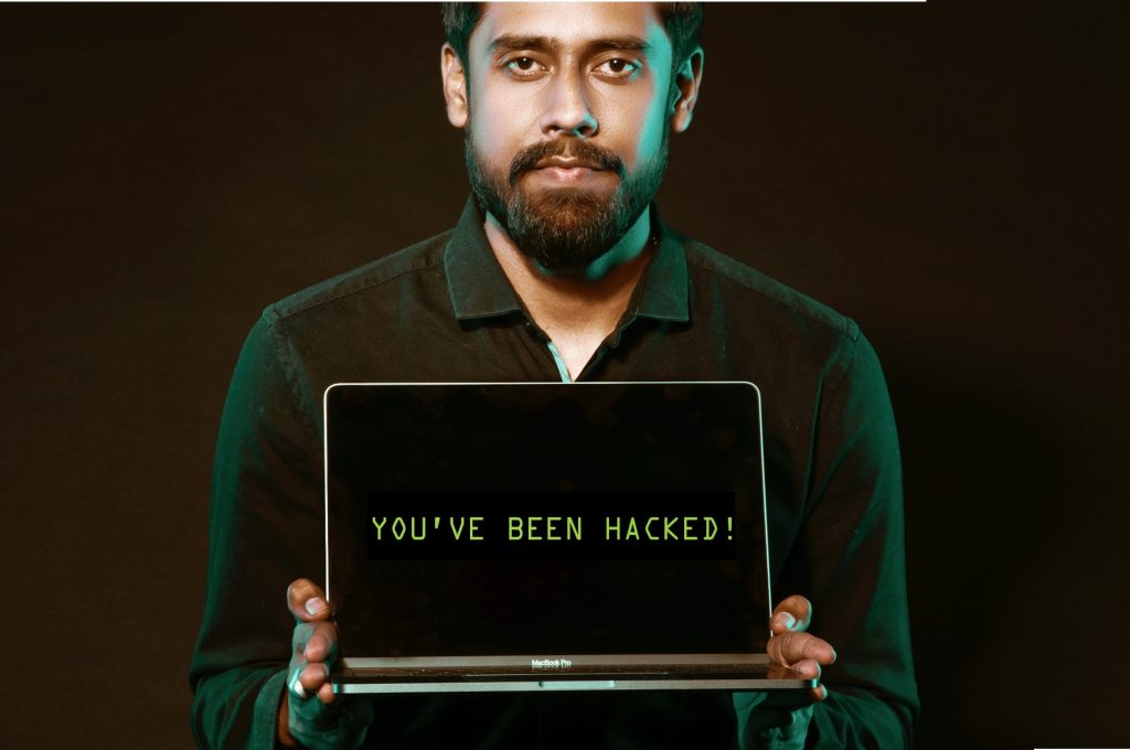 Man holding a computer with the message 