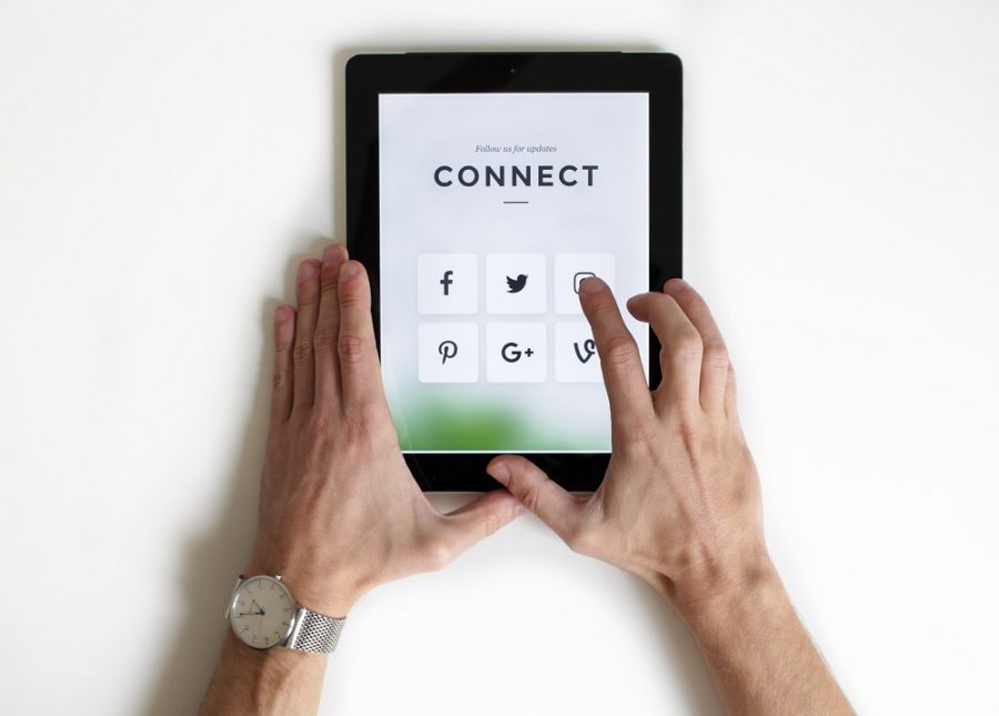 Tablet with Social Media icons and the word 'Connect' on screen