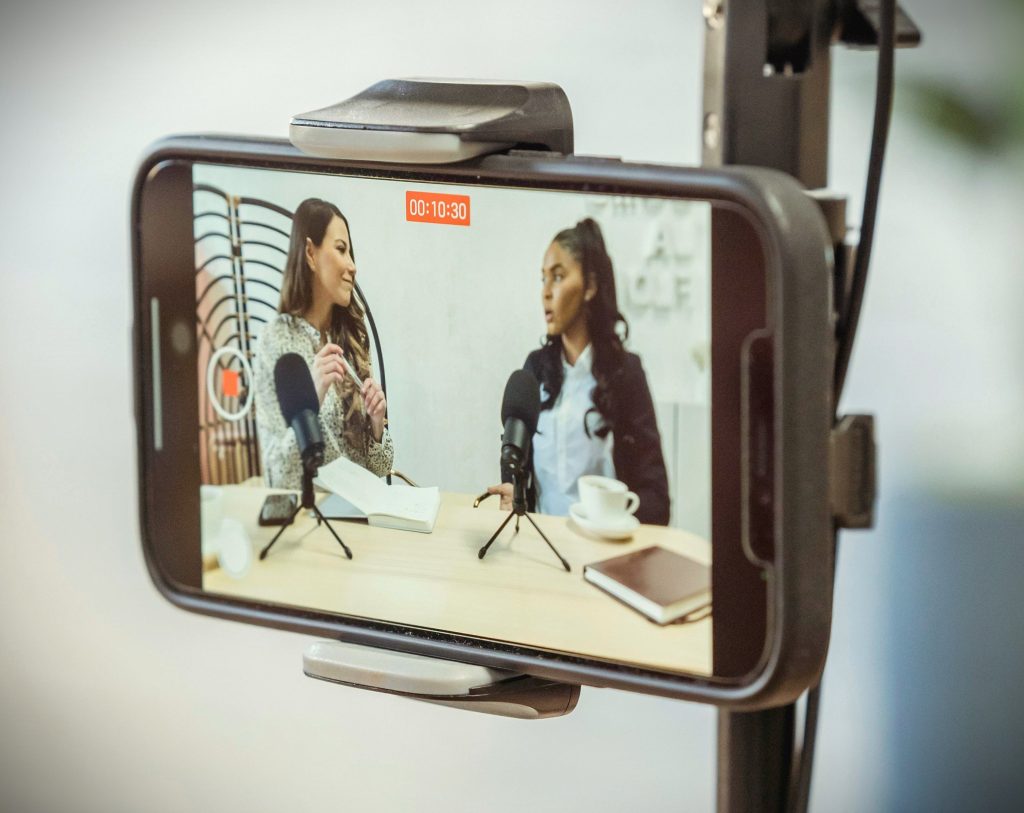 Recording a video of 2 woman holding a discussion on a smartphone